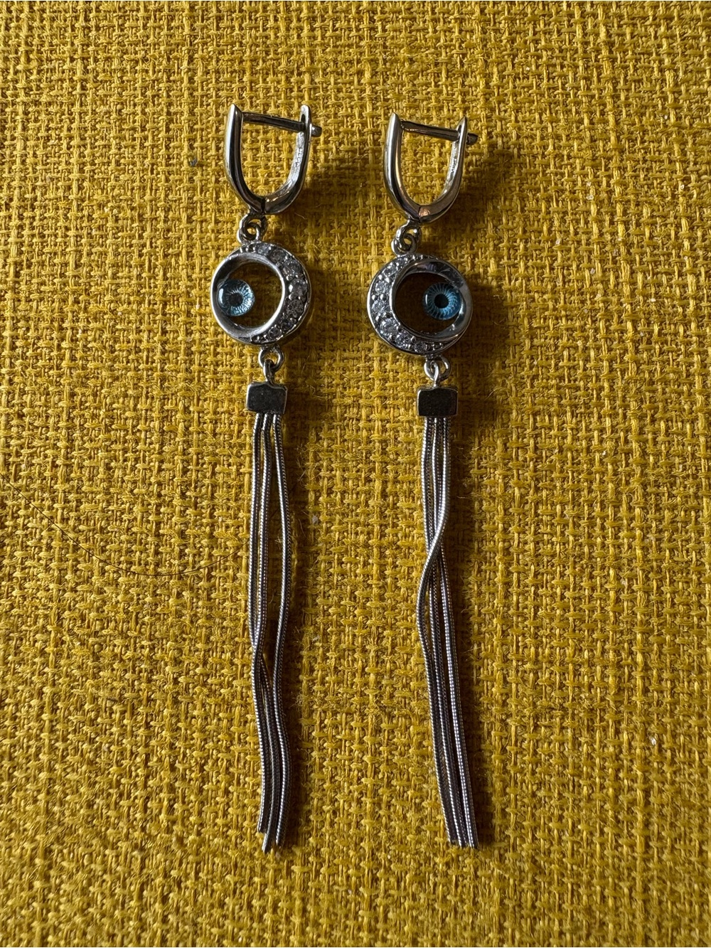 Silver-plated Dangle Earrings with blue evil eye charm and multi-strand tassel